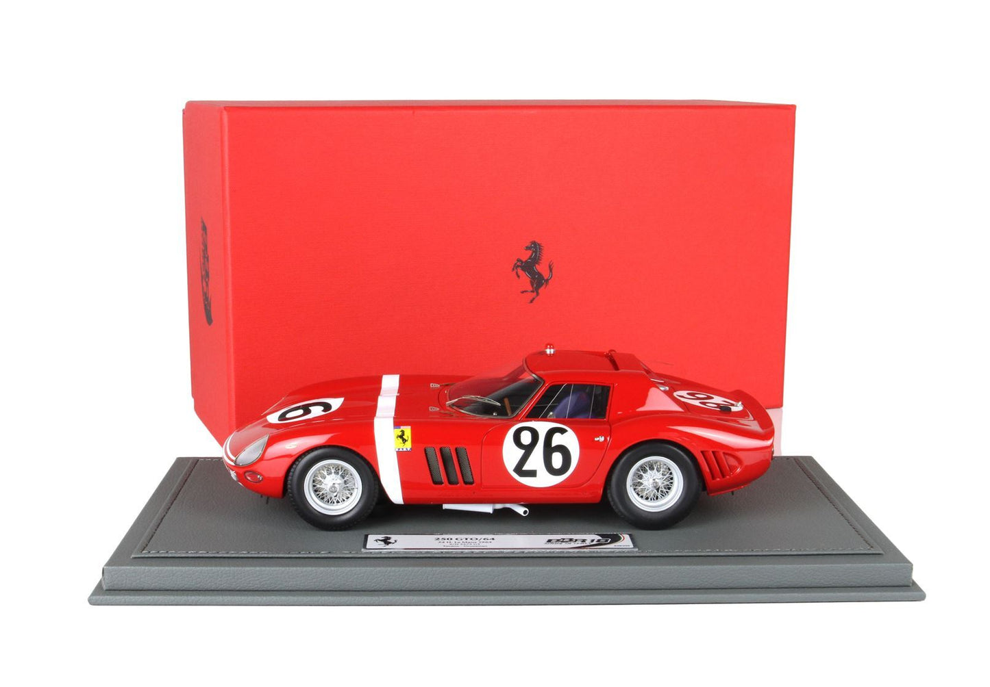 Red Ferrari 250 GTO/64 model with number 26 on grey base, displayed with red branded box, offered on Vroomi