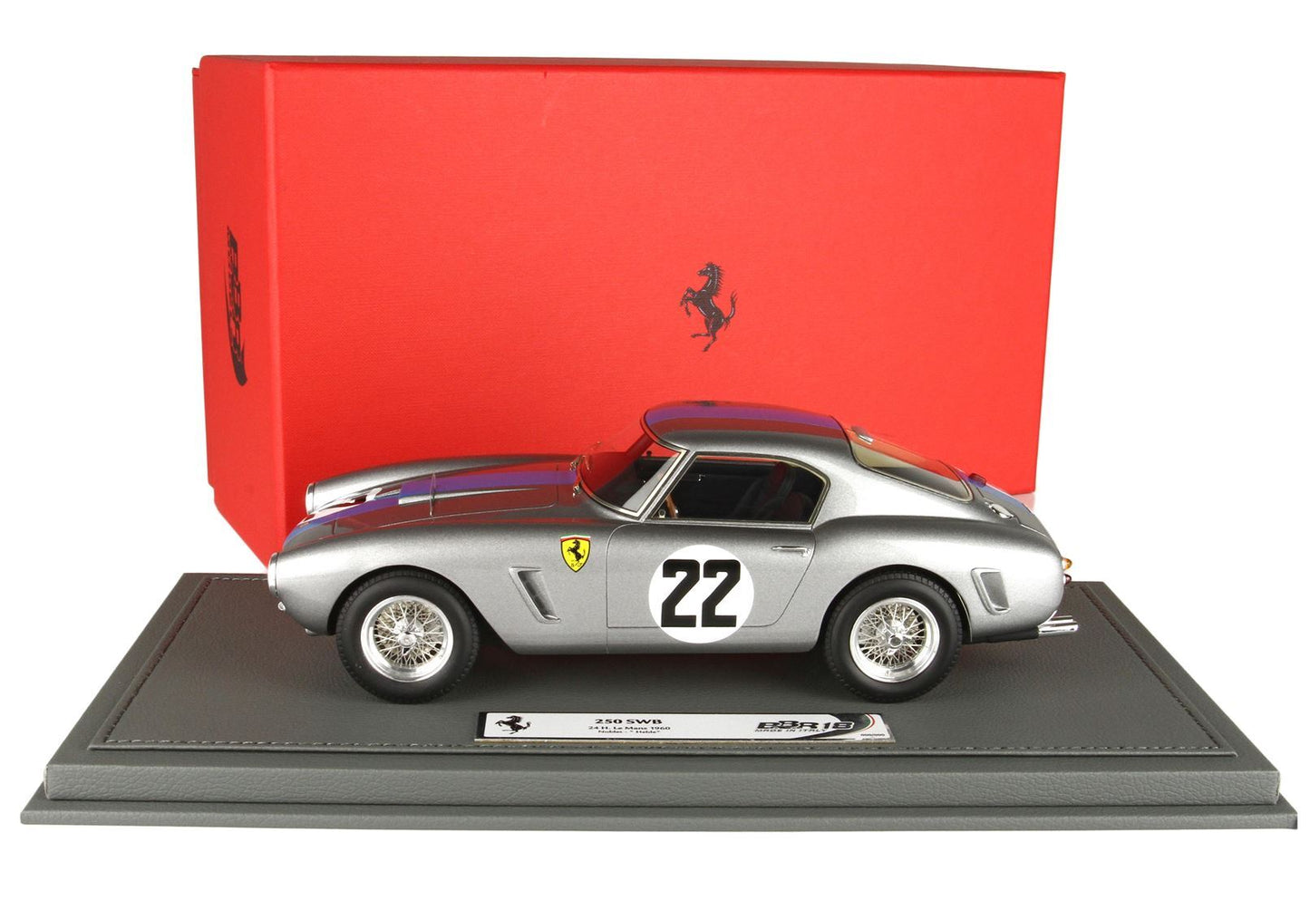 Silver Ferrari 250 SWB model car with number 22 on door, displayed on gray base with red Ferrari box behind, available on Vroomi