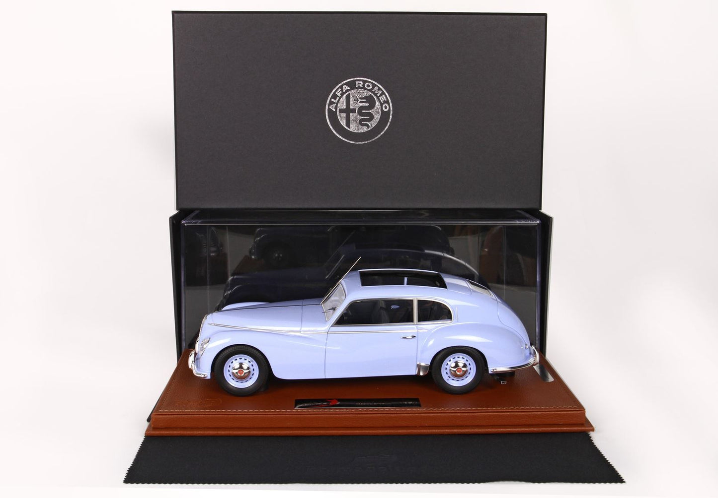 Light blue Alfa Romeo vintage car model in display box on leather base, available on Vroomi