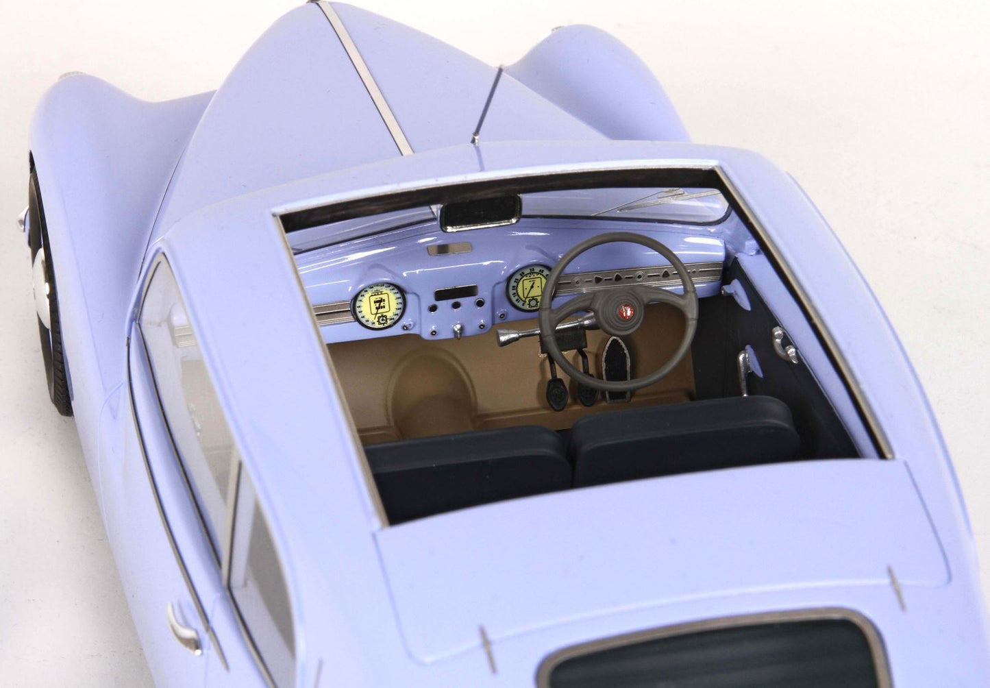 Vintage light blue classic car model interior showing dashboard and steering wheel, available on Vroomi