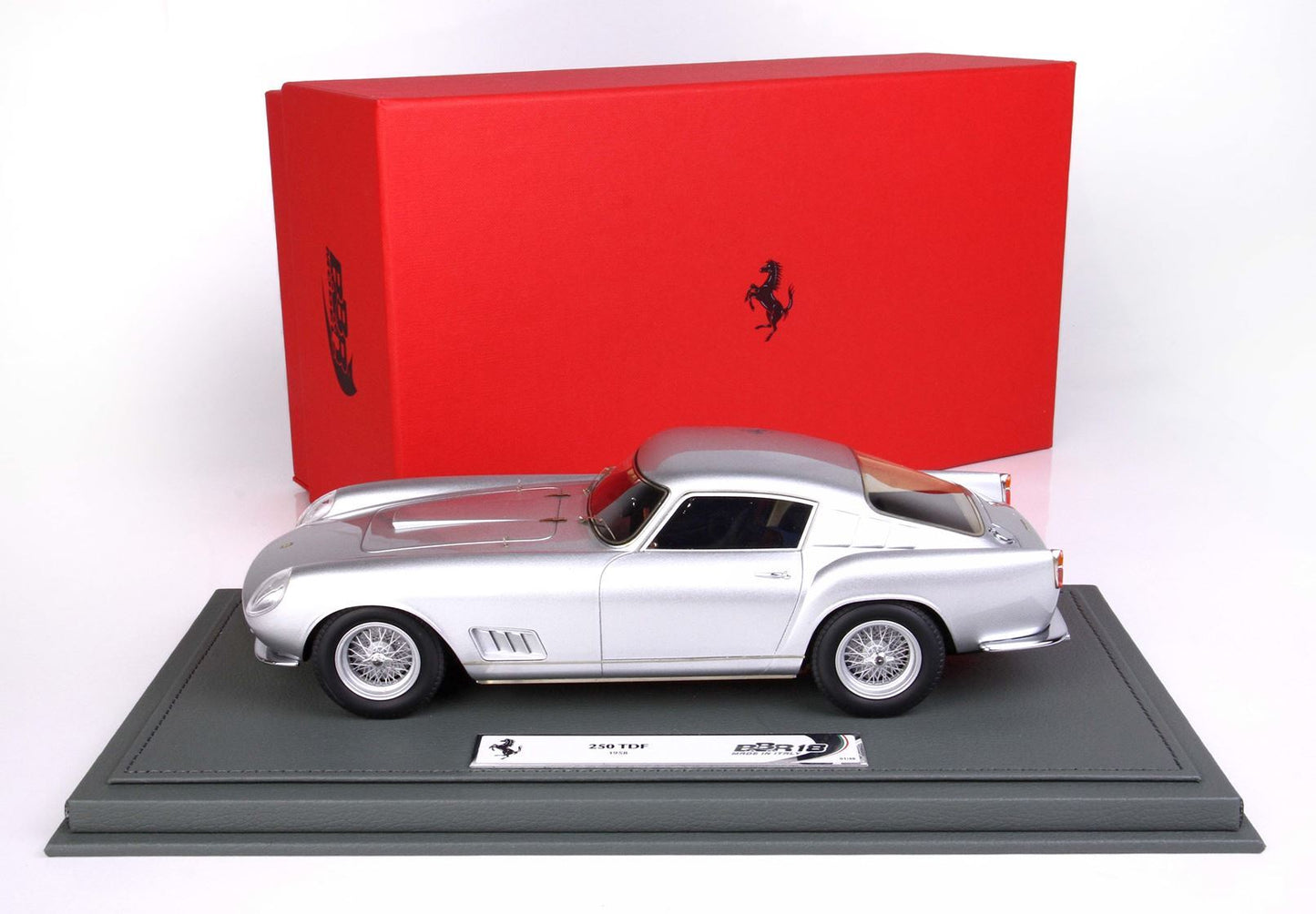 Silver 1958 Ferrari 250 TDF model car on gray base with red Ferrari box, available on Vroomi