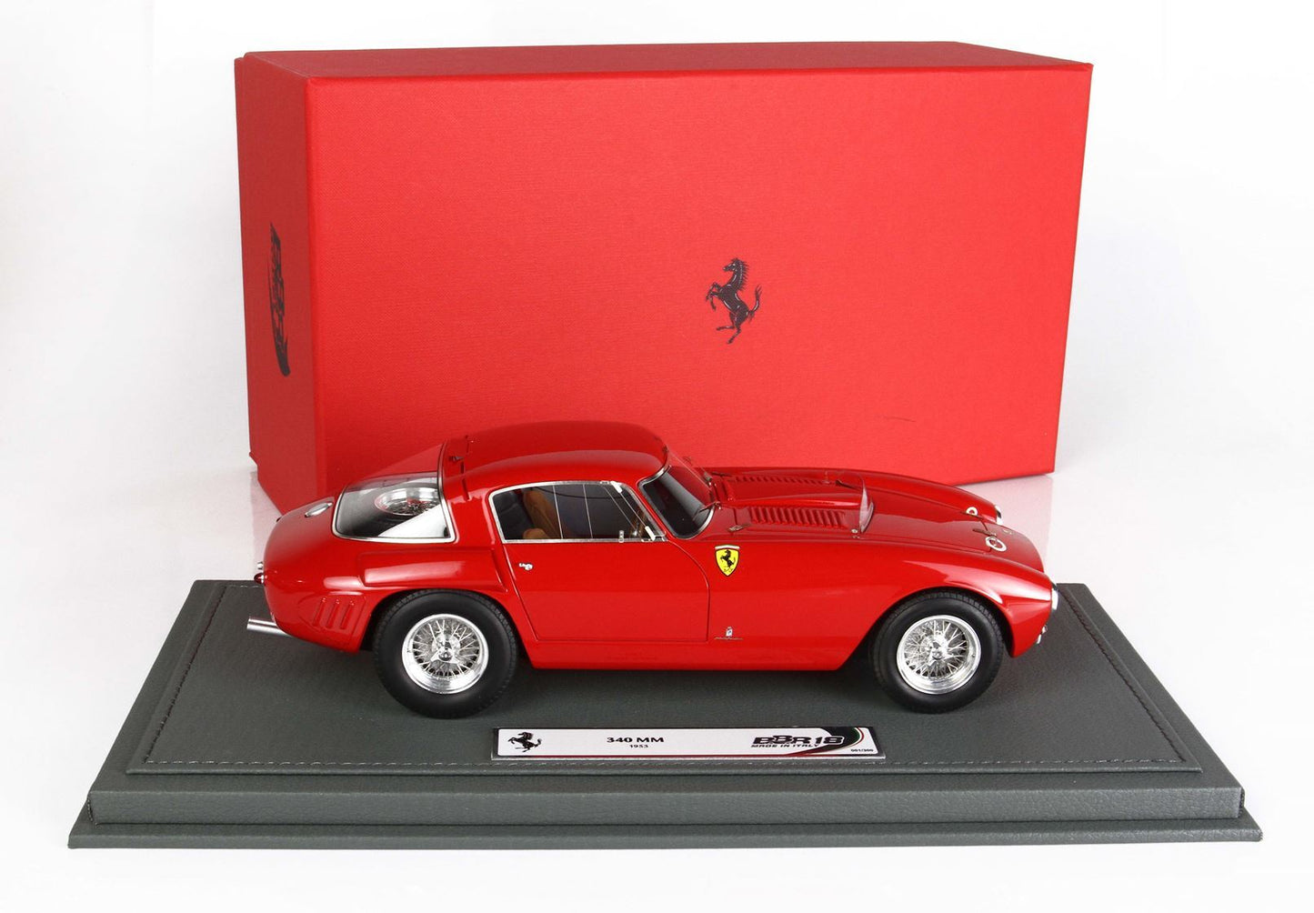 Red Ferrari 340 MM model car on display stand with red Ferrari box, available on Vroomi
