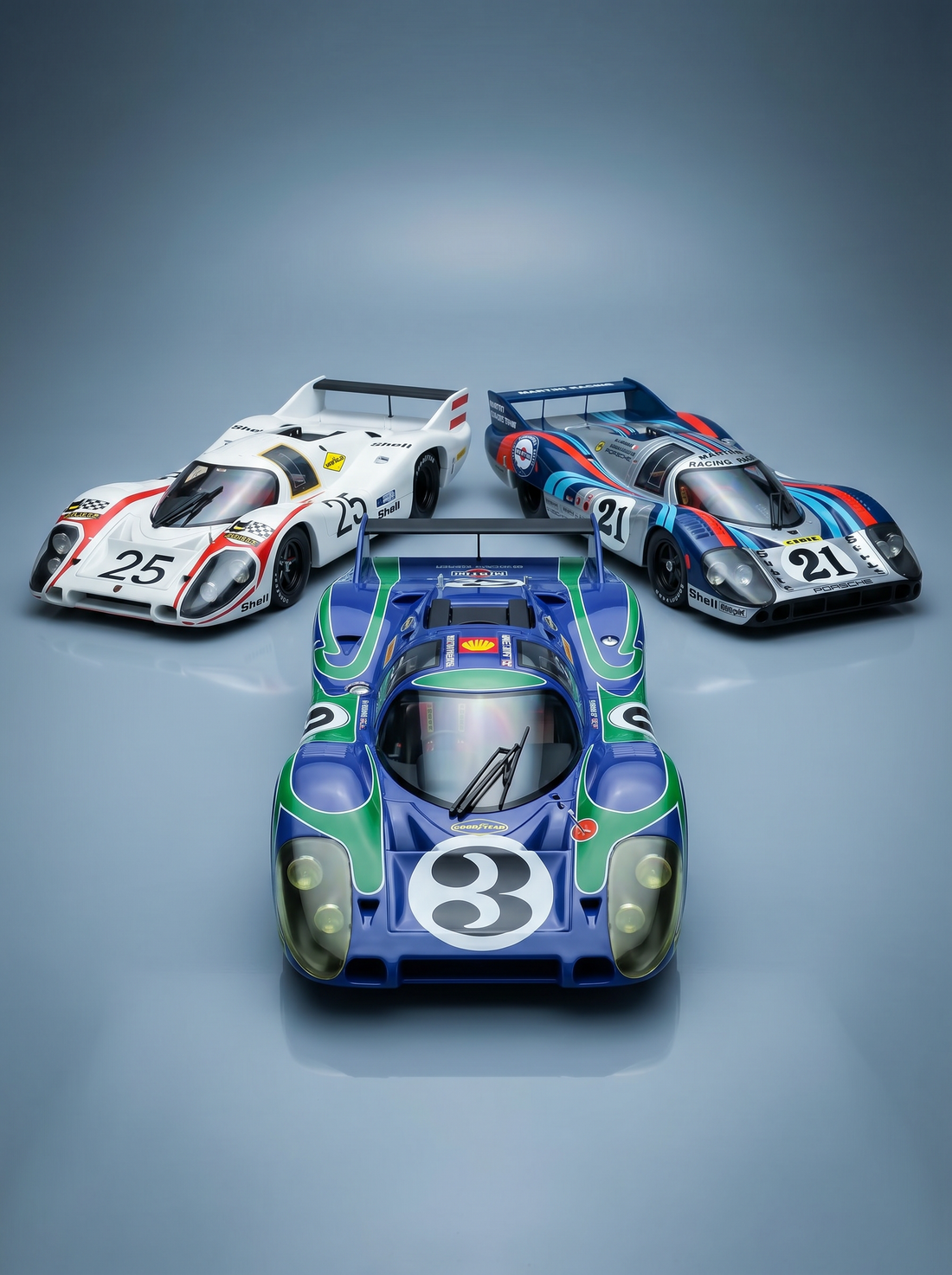 Three Le Mans Porsche 917 scale model cars