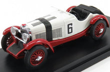 Vintage white and red racing car model with number 6, detailed wheels, on black display, offered on Vroomi