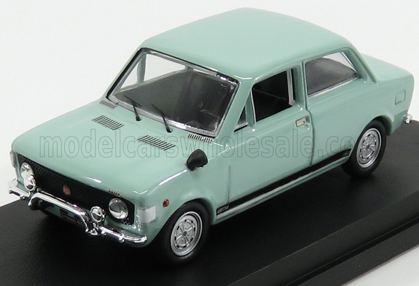 Mint green vintage model car on black display stand, classic 4-door sedan style available on Vroomi