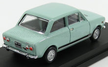 mint green vintage model car on black display stand, classic four-door sedan style, available through Vroomi