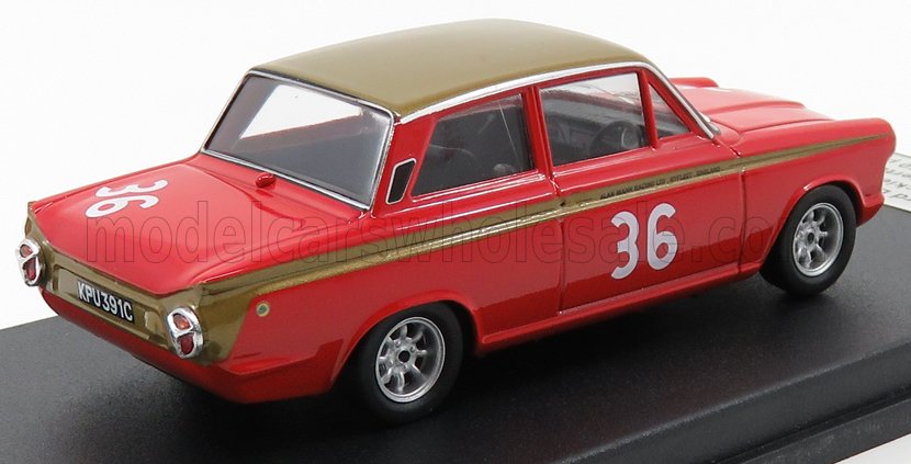 Red and gold vintage race car model with number 36, displayed on a black stand, sold on Vroomi