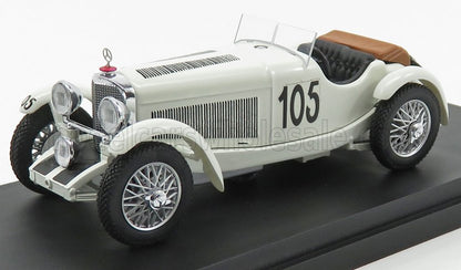 White vintage racing car model with number 105, brown interior, displayed on black base, offered on Vroomi