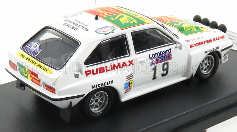 White vintage rally car model with Publimax and Lombard Racing decals, available on Vroomi
