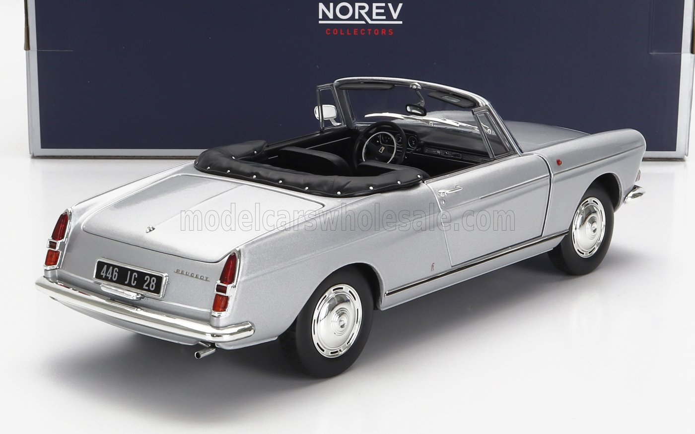 Silver Peugeot classic convertible model car with black interior, available on Vroomi