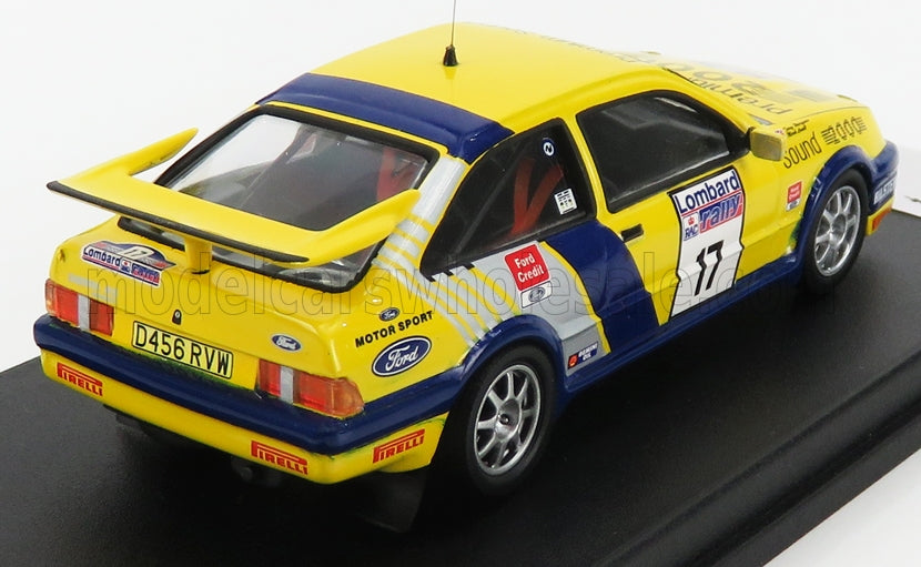 Voiture miniature Ford Sierra RS Cosworth jaune et bleu avec livrée Rallye Lombard RAC, sur socle noir — Vroomi