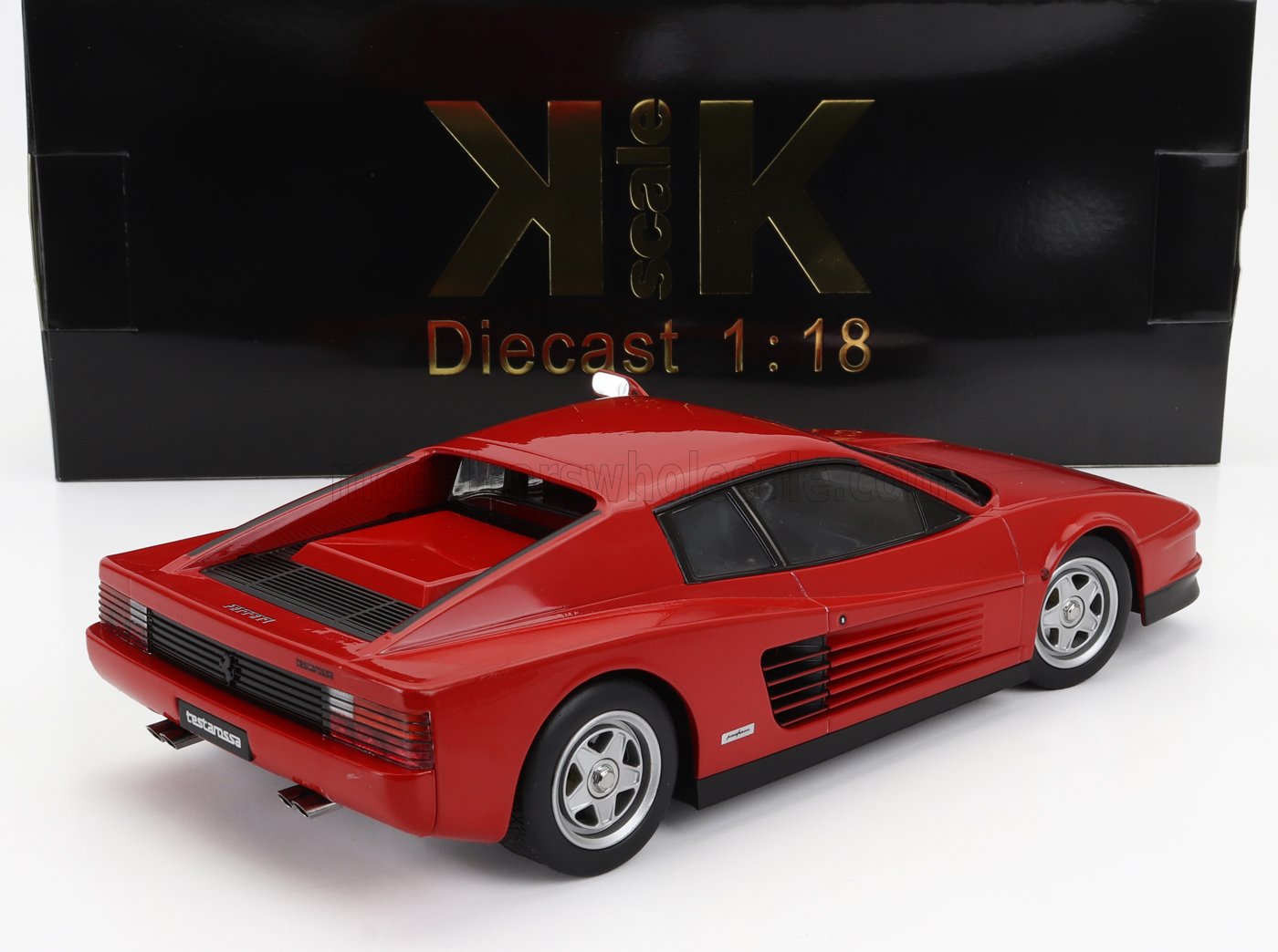 Red Ferrari Testarossa 1:18 scale diecast model car in front of KK Scale black box, available at Vroomi