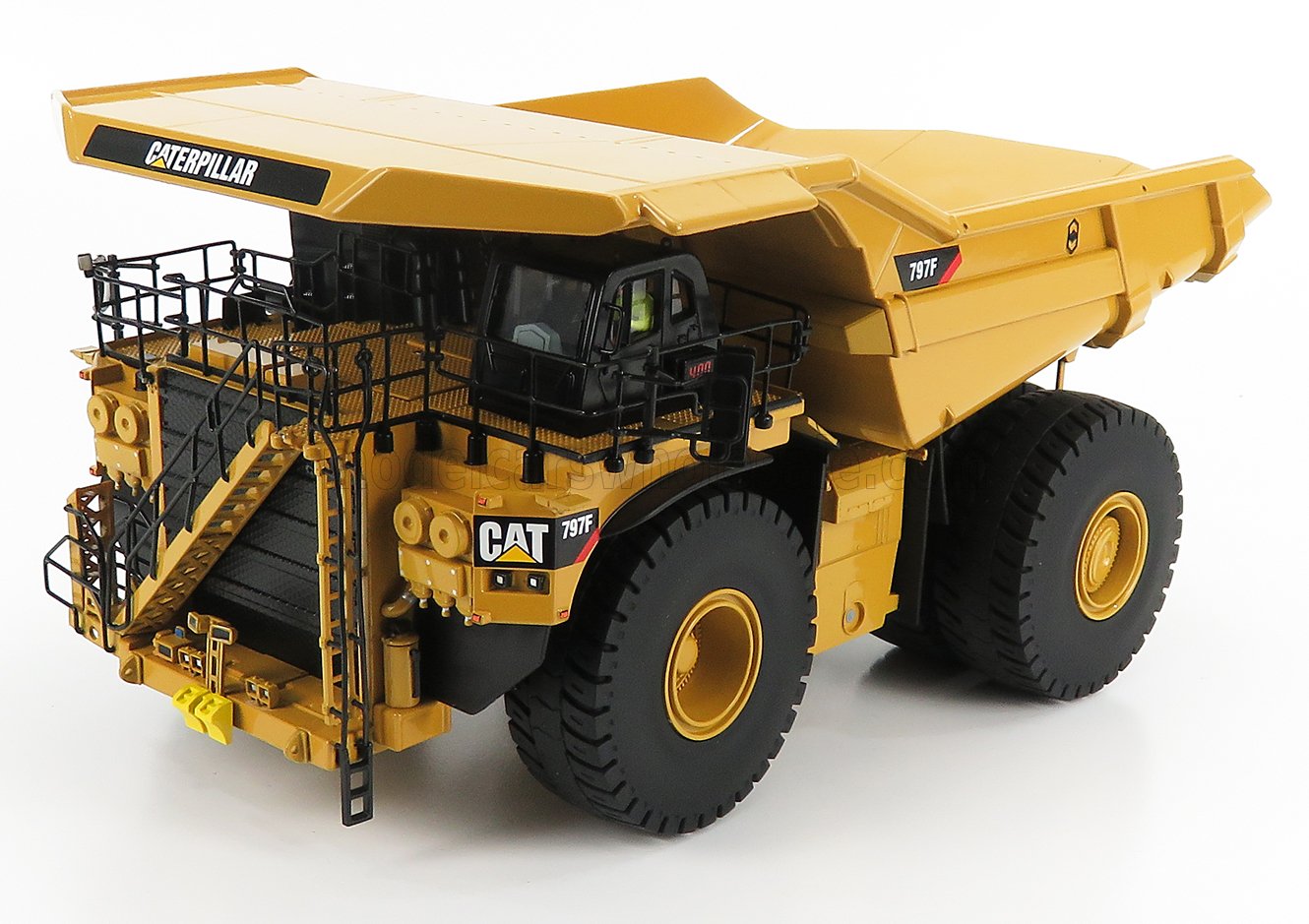 Caterpillar CAT 797F large yellow mining dump truck model with black railing, available via Vroomi