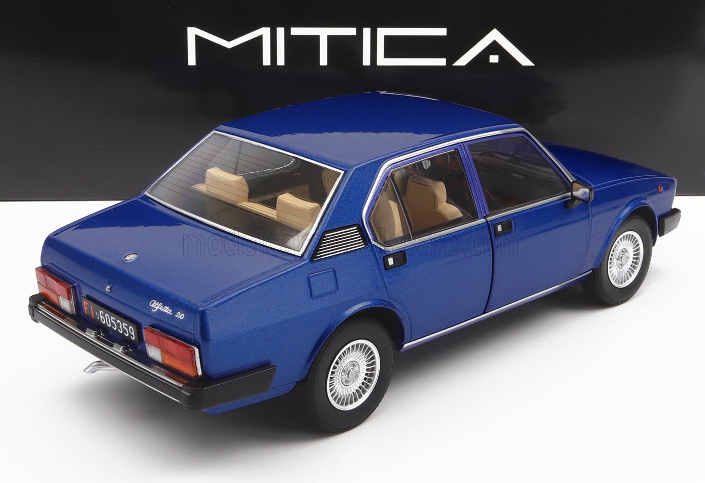Blue Alfa Romeo Alfetta 2.0 model car with beige interior on display, available through Vroomi
