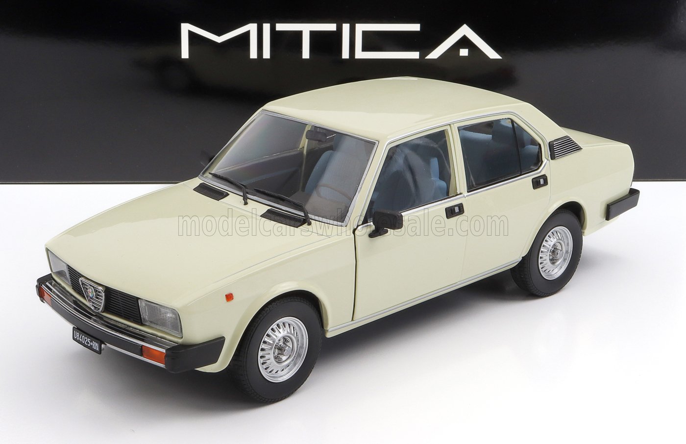 Cream-colored vintage Alfa Romeo sedan model car displayed with Mitica logo, now offered on Vroomi