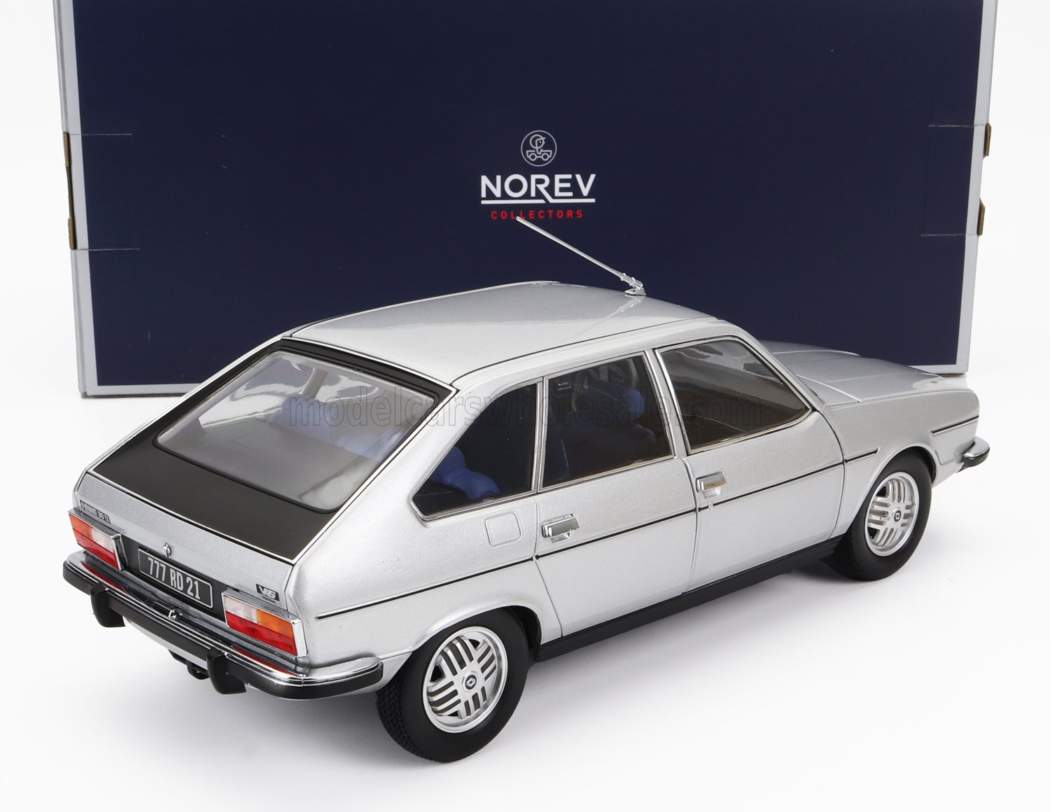 Silver Norev Collectors model car, classic hatchback with blue seats, featured on Vroomi
