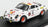 Voiture miniature de rallye blanche avec décalques sponsors et roues oranges, présentée à Vroomi