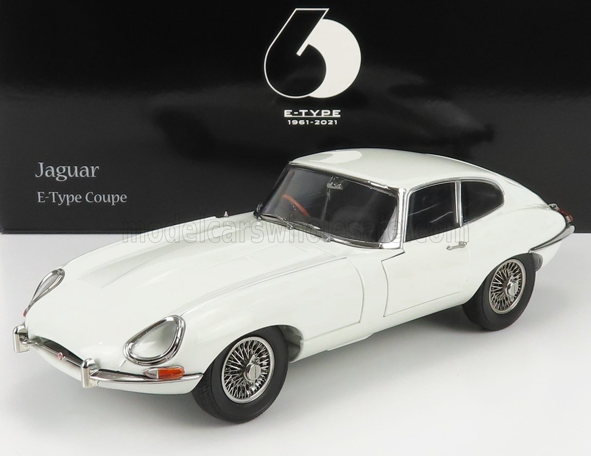 Model of a Jaguar E-Type Coupe on a white background with a black banner displaying 'Jaguar' and 'E-Type Coupe'.