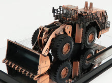 Detailed bronze model of a CAT 990K wheel loader displayed on reflective surface, now featured on Vroomi