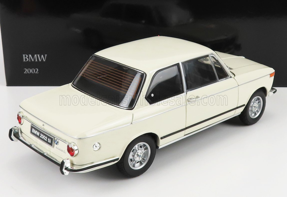 White BMW 2002 model car collectible displayed with black background, available on Vroomi