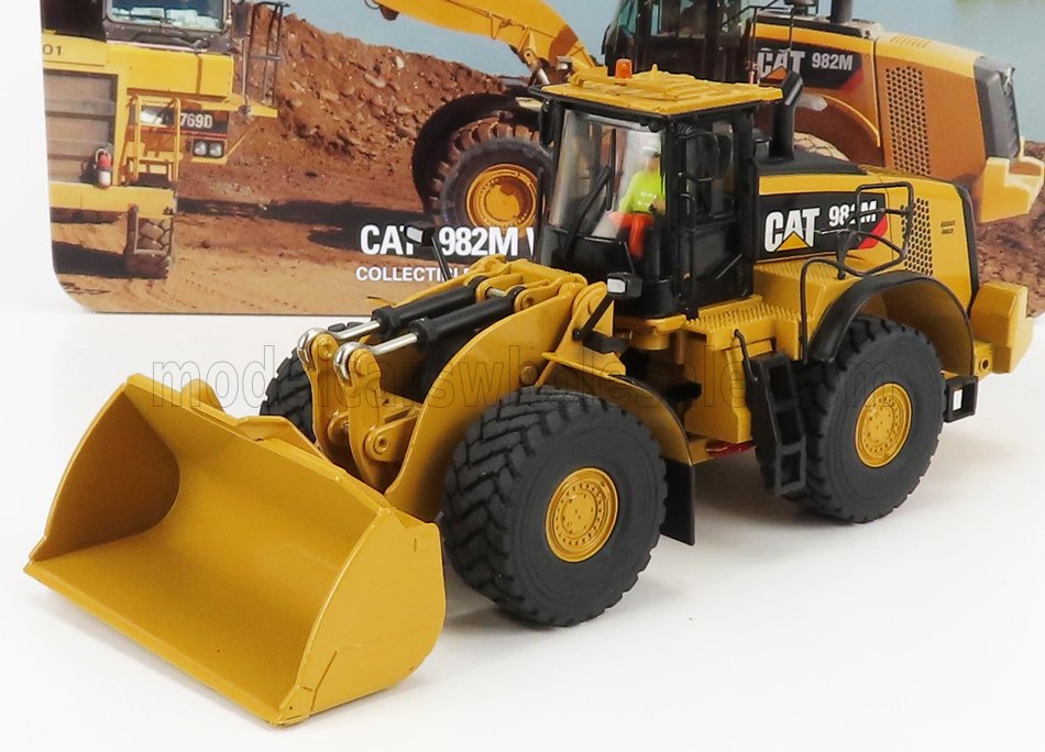 Detailed scale model of CAT 982M wheel loader with authentic hydraulic bucket, featured with promotional display, offered on Vroomi