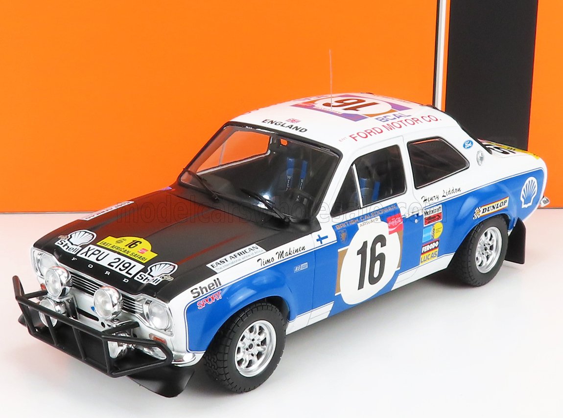 Model car of a Ford Escort RS2000 with racing livery on an orange background
