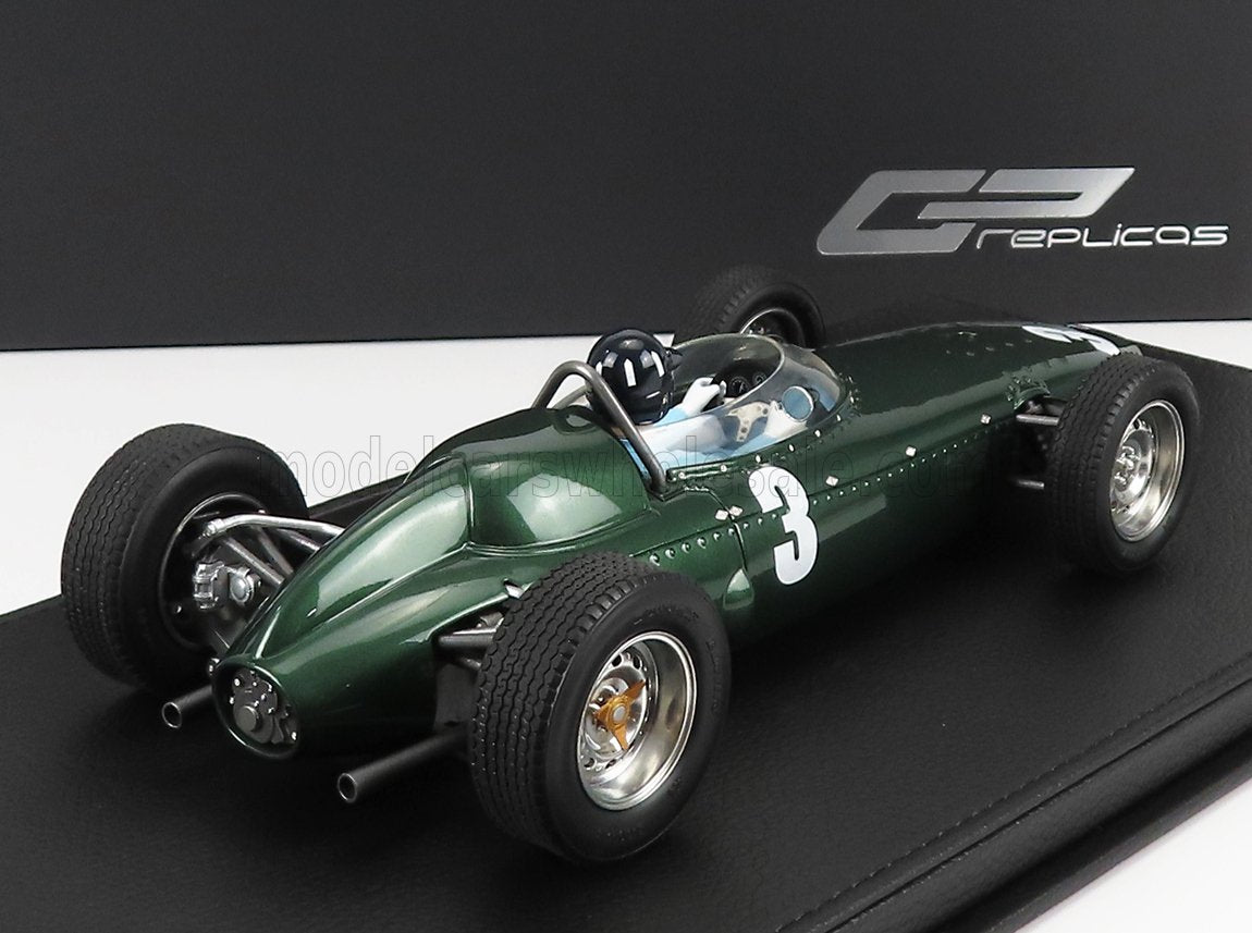 Green vintage Formula 1 race car model with number 3, displayed on black base, available on Vroomi