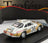 Voiture miniature blanche et dorée N 36 avec livrée Kent, présentée sur socle noir — Vroomi
