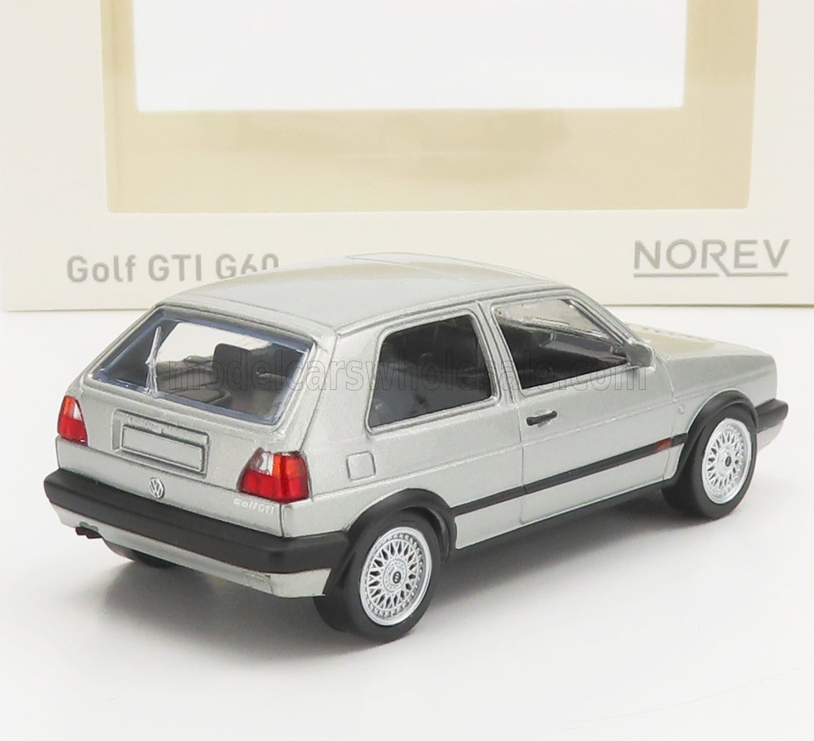Silver Volkswagen Golf GTI G60 diecast model car by Norev with detailed wheels, available on Vroomi