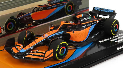 McLaren F1 model car in orange and blue with sponsor logos, available on Vroomi platform