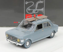 Detailed grey classic model car with wooden roof rack, displayed with RIO box, available on Vroomi