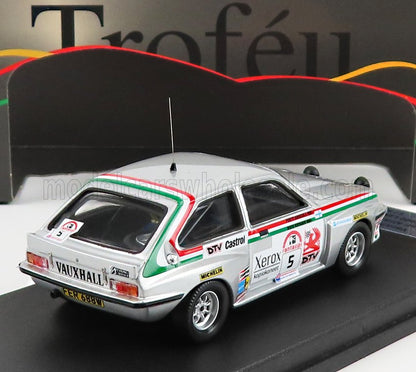 Silver Vauxhall Firenza race car model with rally decals and green-red stripes, shown at Vroomi