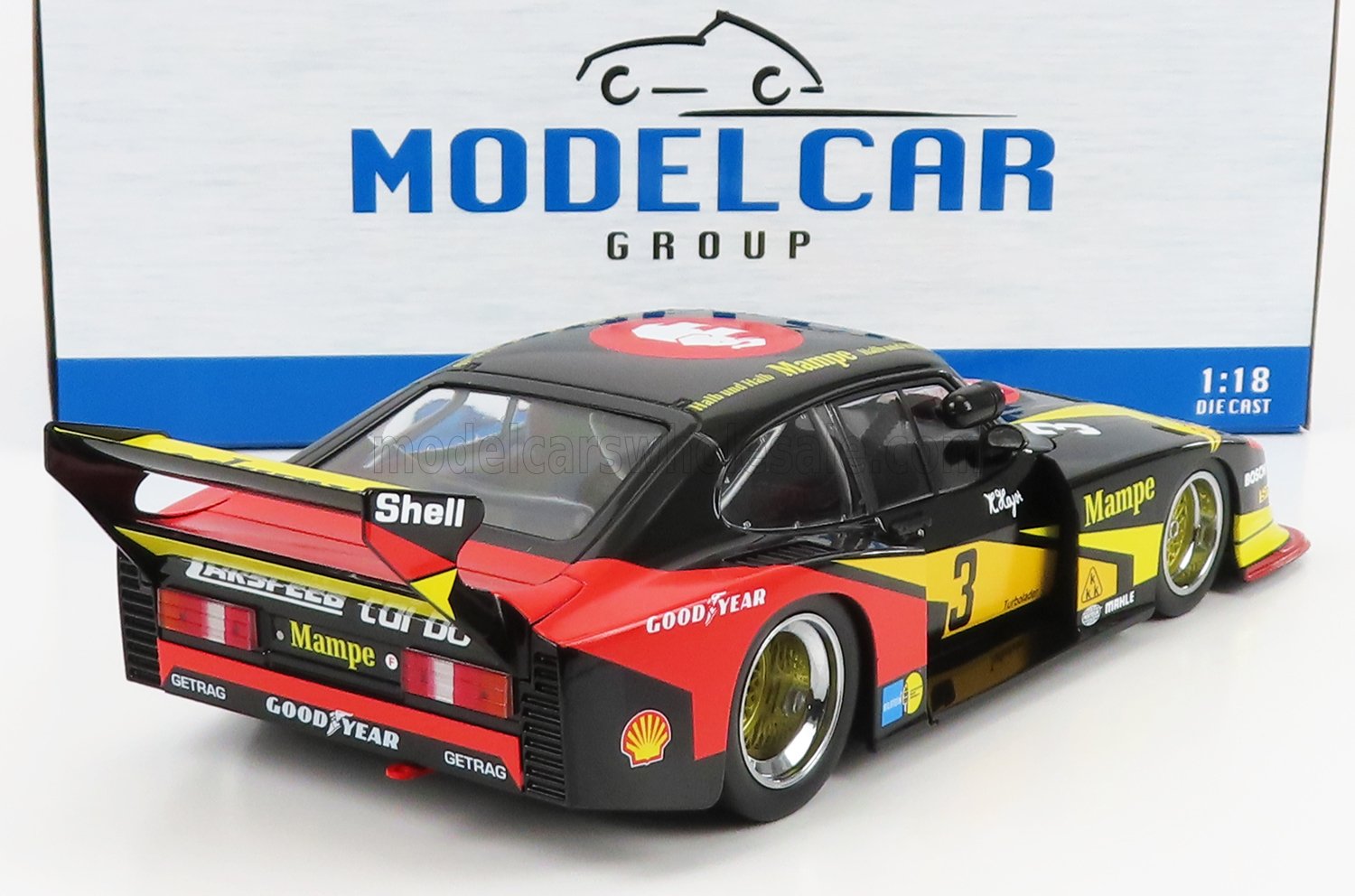 Modellino di auto da corsa Porsche in scala 1:18, nero, rosso e giallo, con i loghi Mampe e Shell, disponibile su Vroomi.