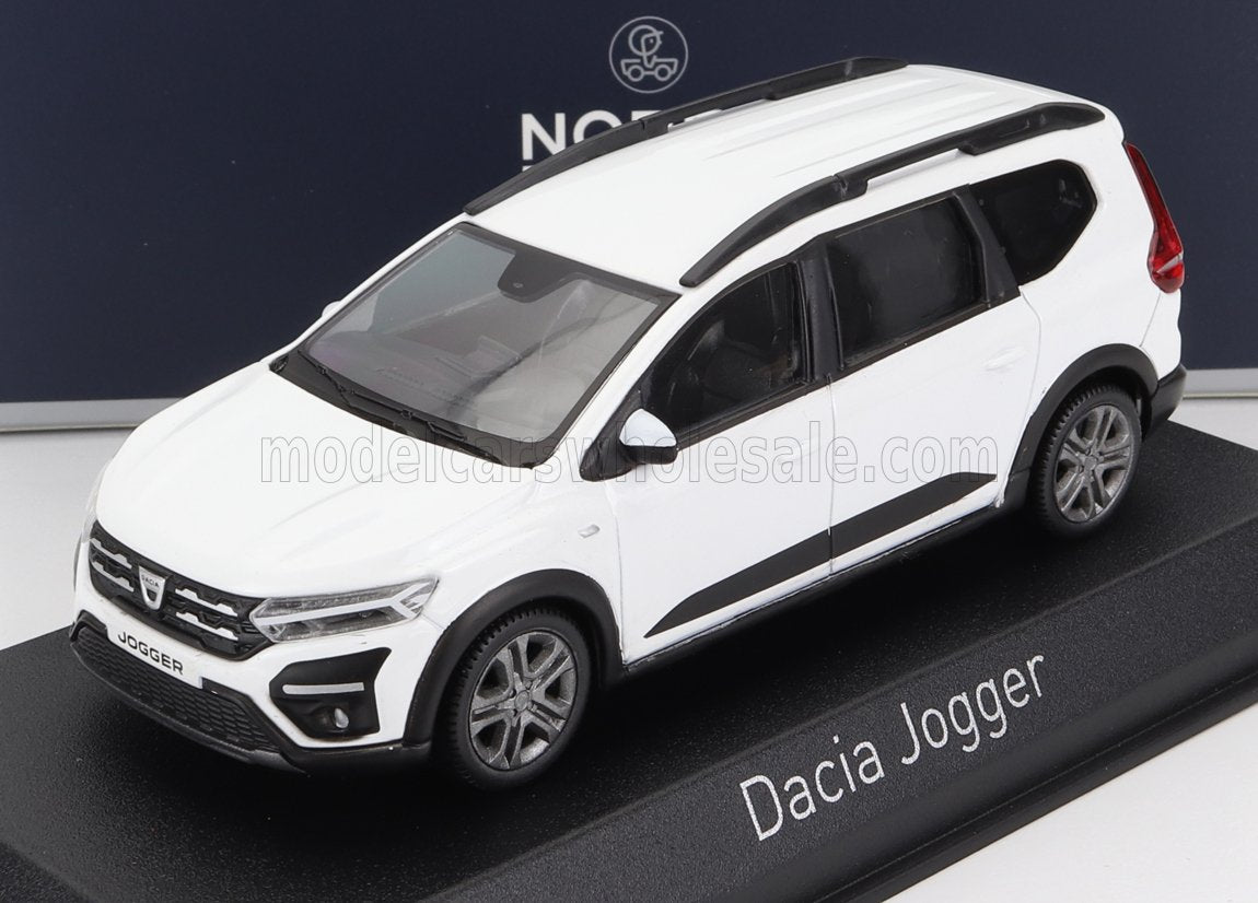White Dacia Jogger model car displayed on black stand, available now on Vroomi platform