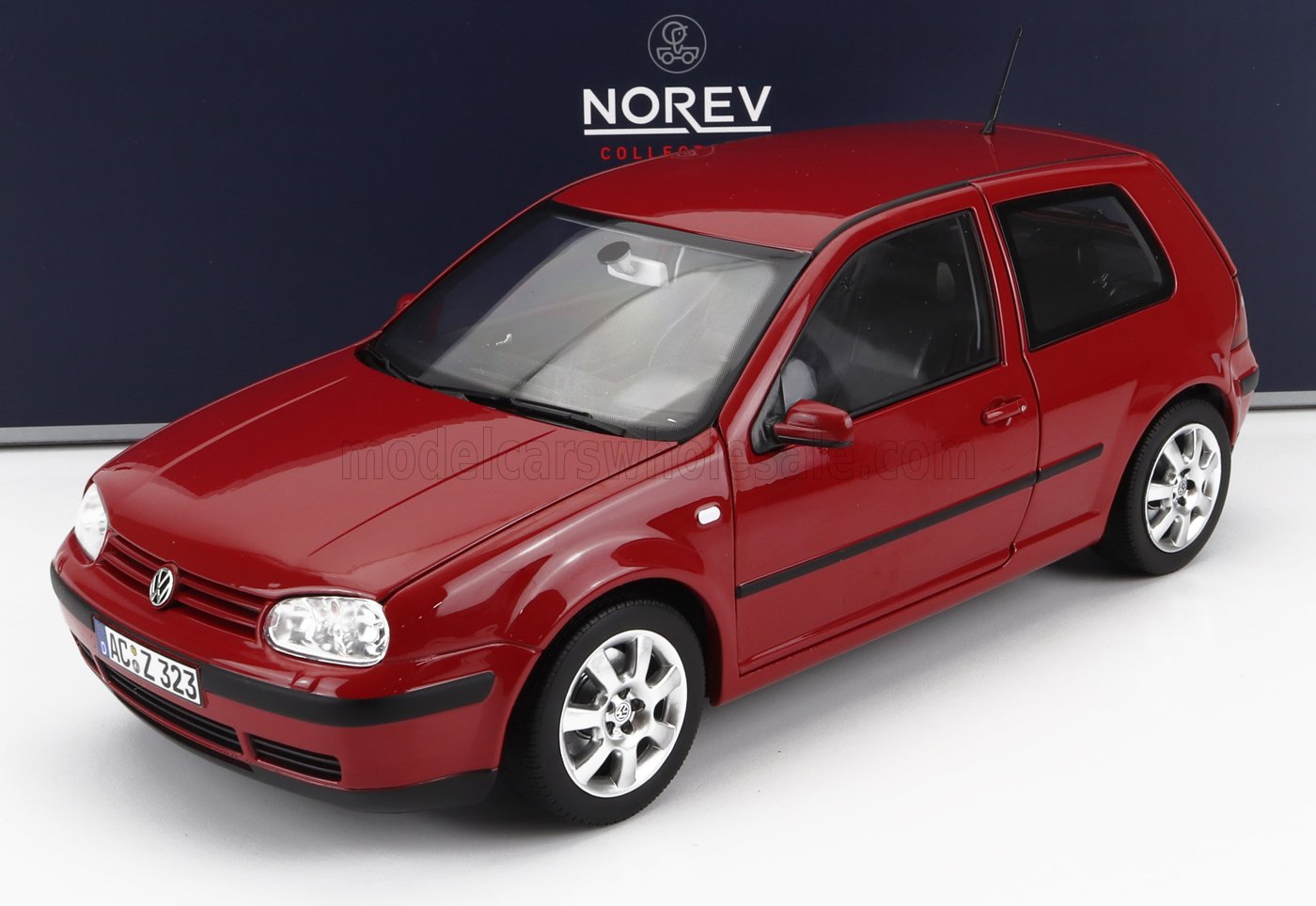 Red Volkswagen Golf model car by Norev, detailed miniature available on Vroomi platform