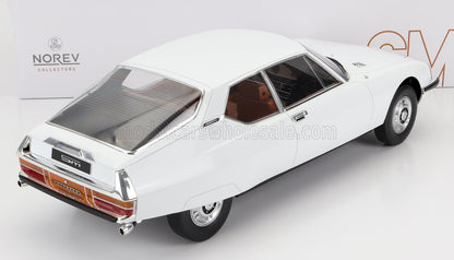 White vintage Citroën SM model car with detailed interior, featured by Norev Collectors, offered via Vroomi