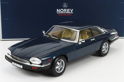 Dark blue Jaguar XJ classic car model with beige interior on white surface with Norev Collectors box available on Vroomi