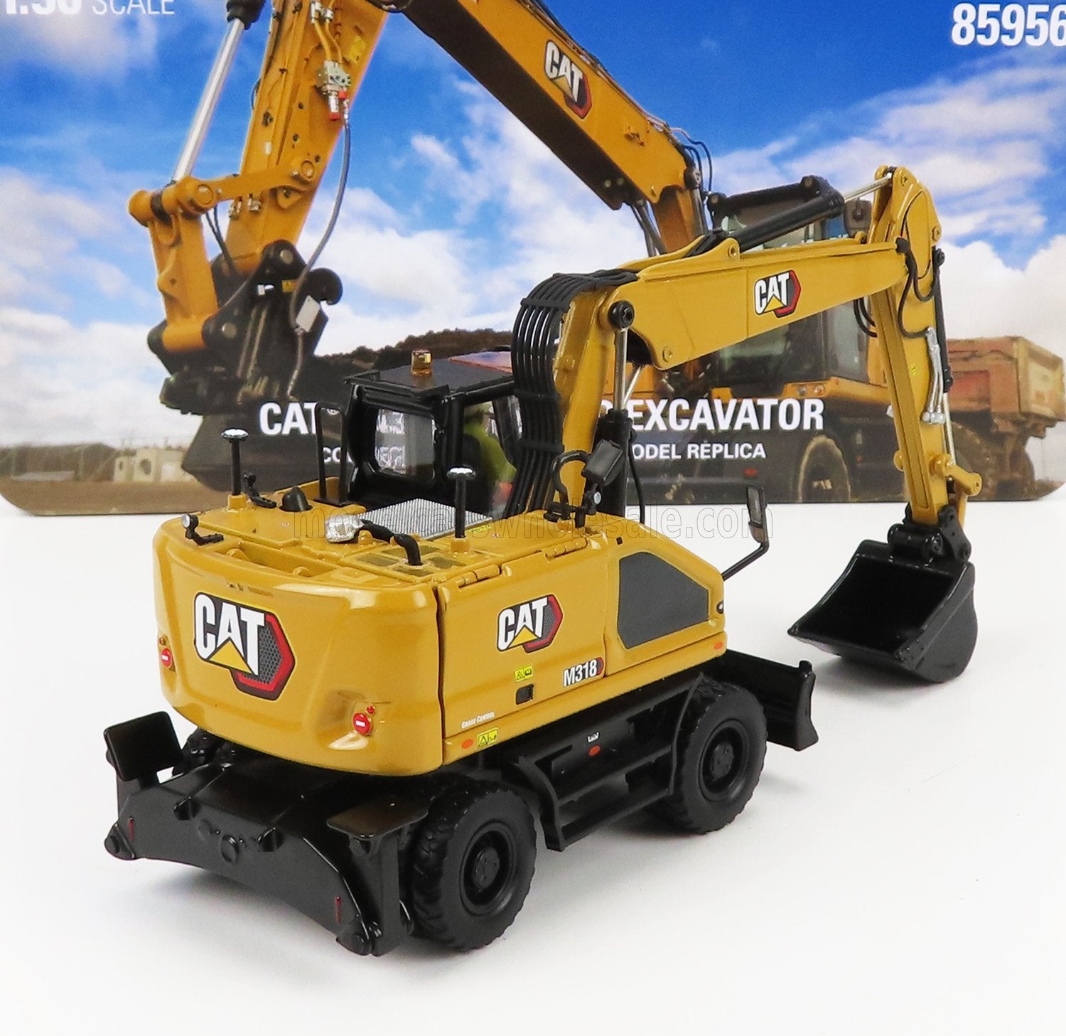 Detailed CAT M318 wheel excavator scale model in yellow and black, available at Vroomi collectors shop
