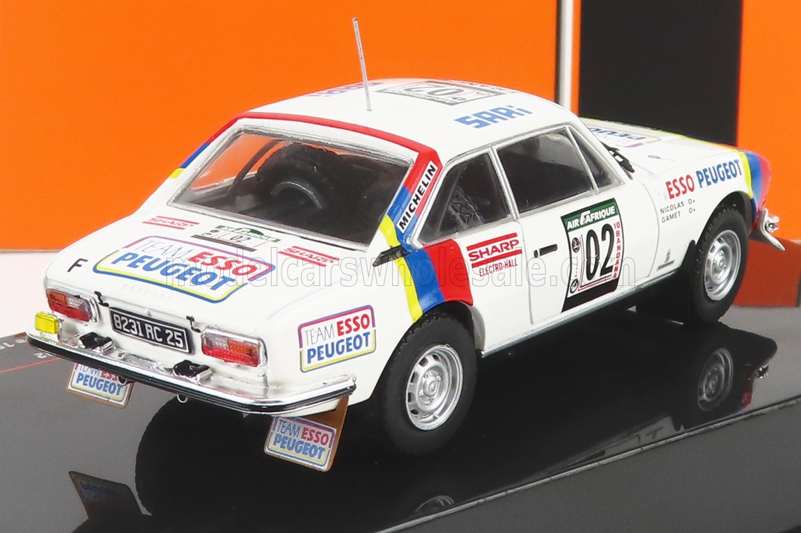 White Peugeot rally scale model car with Esso, Michelin decals, displayed at Vroomi