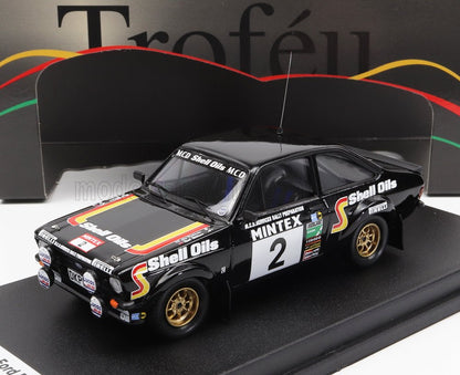 Black Ford Escort rally car model with Shell Oils livery, number 2, displayed with Troféu box, available on Vroomi
