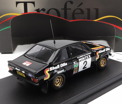 Black Ford Escort rally car model with Shell Oils and Mintex decals, gold wheels, on display platform, sold on Vroomi