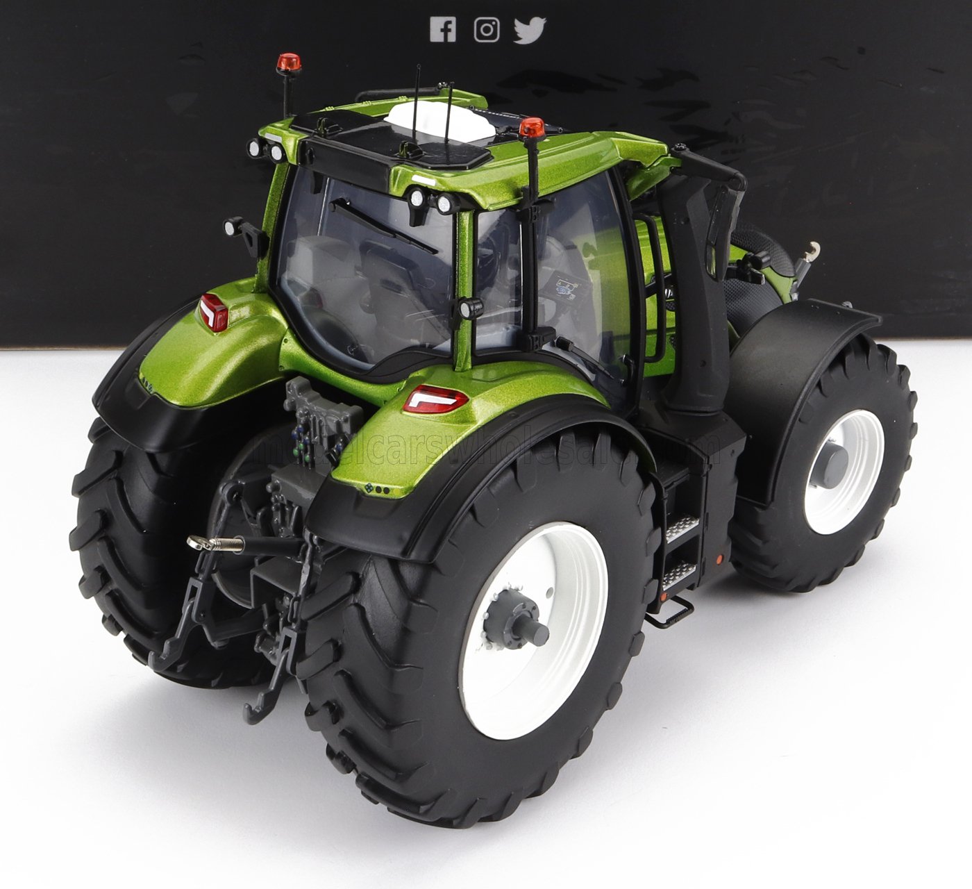 1/18 scale green die-cast model tractor with detailed tires and cabin, available now at Vroomi