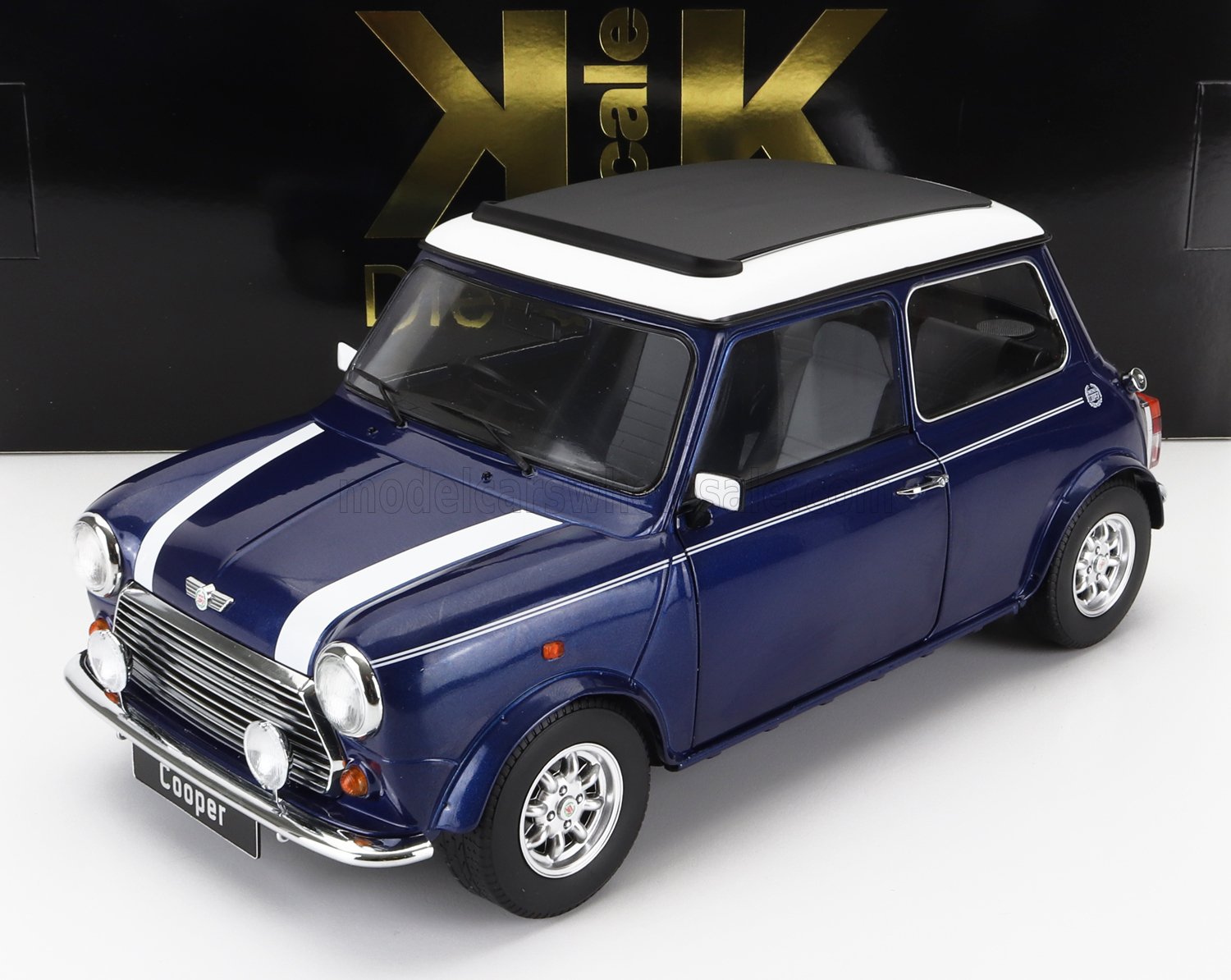 Blue Mini Cooper model car with white racing stripes and roof, detailed features, available on Vroomi