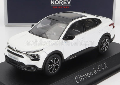 White Citroën ë-C4 X scale model car by Norev on display stand, available on Vroomi