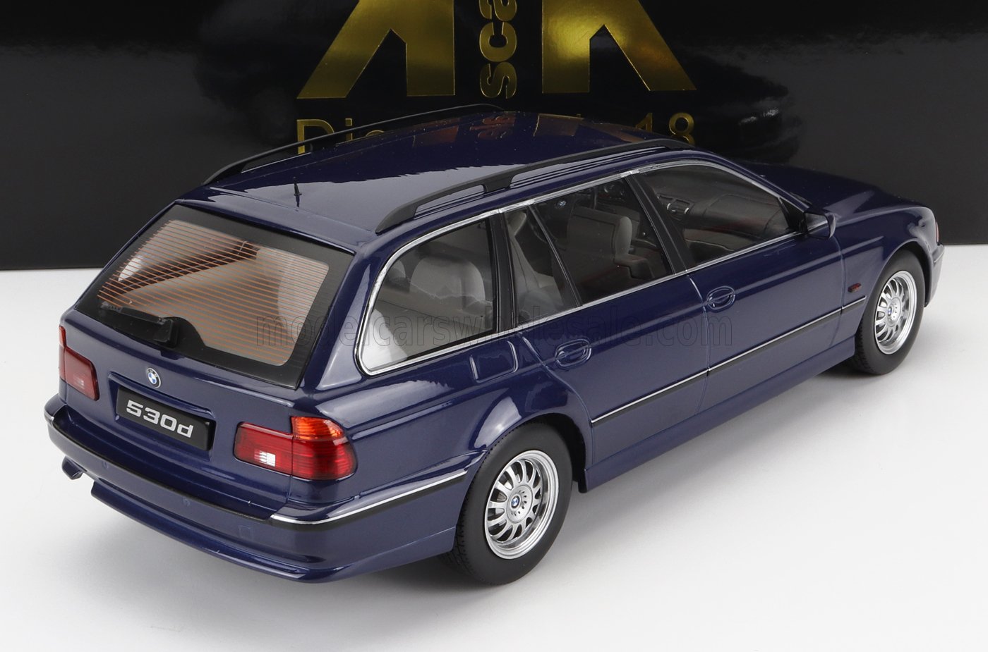 Blue BMW 530d station wagon model with silver wheels, detailed interior, available on Vroomi platform