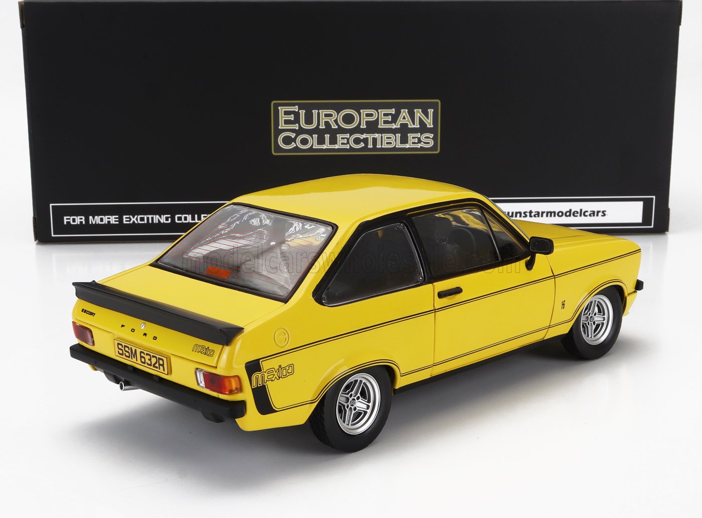 Yellow Ford Escort Mexico 1/18 die-cast scale model car with black stripes, available at Vroomi.