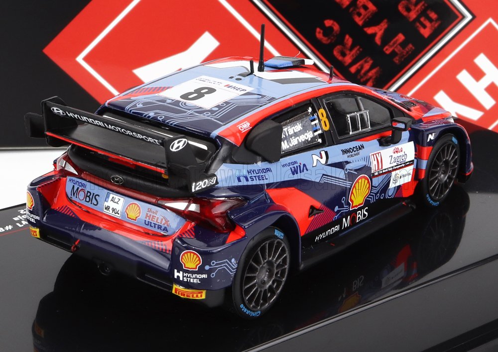 Voiture miniature Hyundai Rallye avec décalcomanies Shell et Mobis, présentée sur surface réfléchissante chez Vroomi