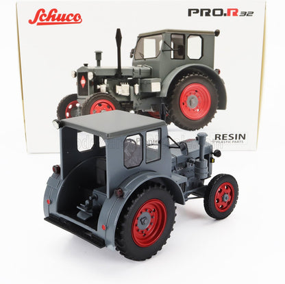 Schuco PRO.R32 gray and red resin scale model tractor with detailed cabin and tires, available at Vroomi