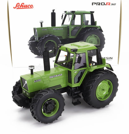Modellino del trattore Hürlimann H-6130 verde di Schuco con pneumatici dettagliati, esposto con la sua scatola, disponibile da Vroomi.