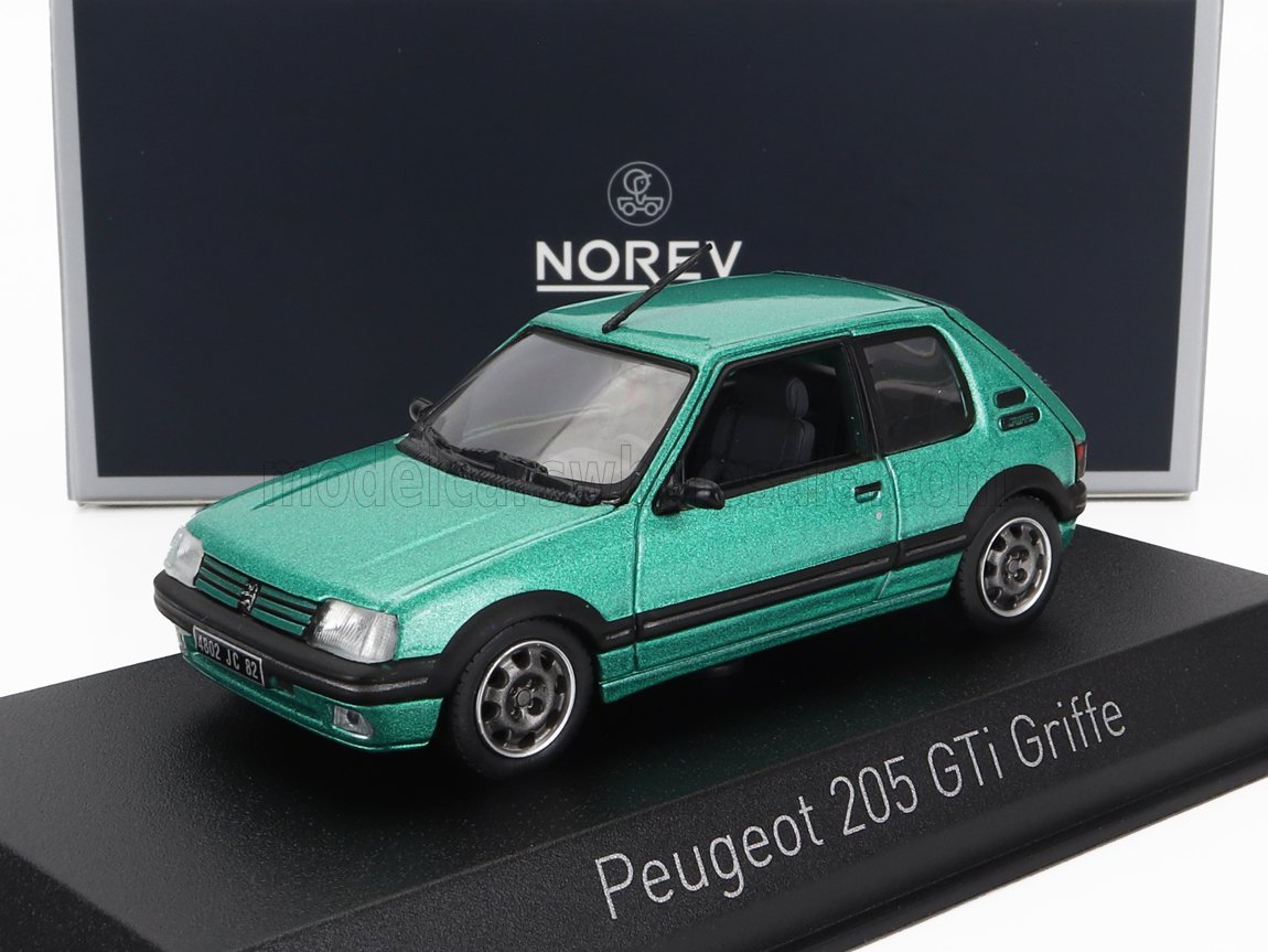 Green Peugeot 205 GTi Griffe model car on display stand, featured on model car retailer Vroomi